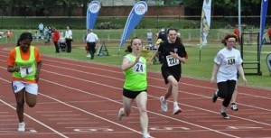 Crossing the finish line first in the 100m